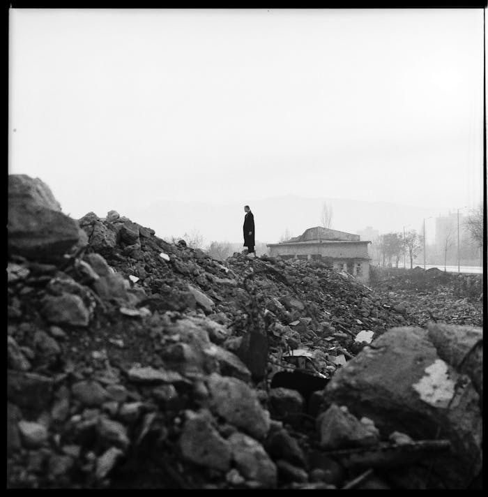 Person Standing On Rocks